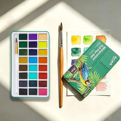 Mont Marte Watercolor Full Pan Set Signature 25pc, Watercolor Paint Set Featuring 24 Full Pan Colors and Round Brush, Includes Study Travel Tin and Four Mixing Wells